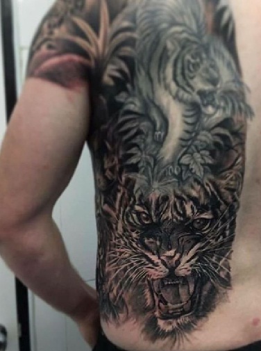 Roaring Tattoo On Back Shoulders