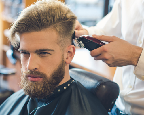 Young Man in Barbershop Hair Care Service Concept