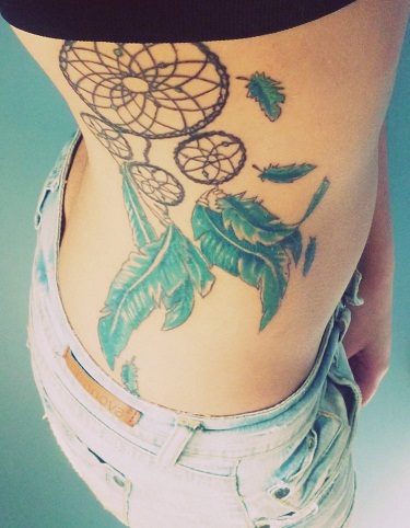 dream catcher tattoo on ribs