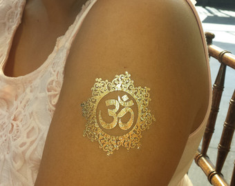 Gold Religious Tattoo