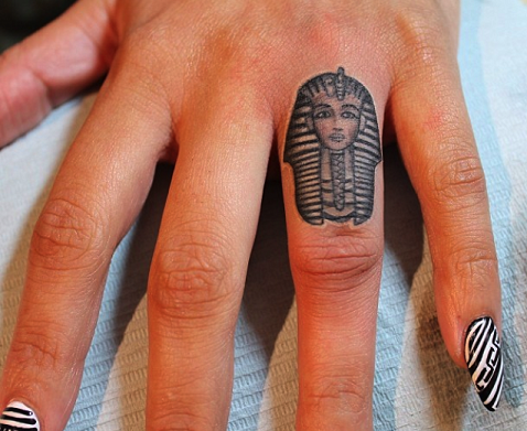 Small finger Black ink King Tut tattoo design