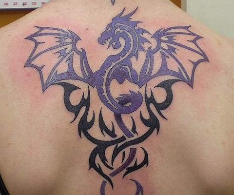 Flying dragon tribal tattoo