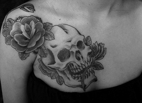 Skull with roses collar bone tattoo