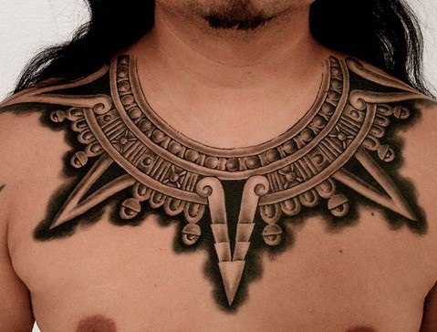 Tribal collar bone tattoo