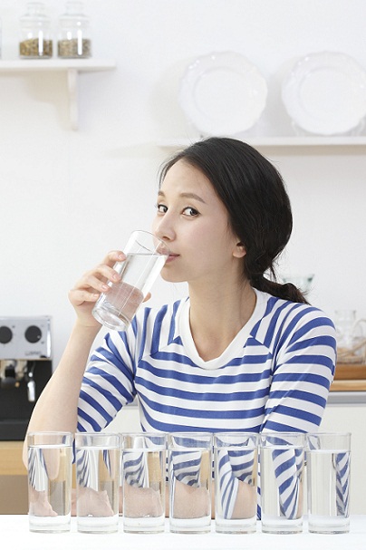 Asian woman drinking water