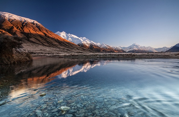 Winter sunrise looking across the Tasman River towards Aoraki / Mt Cook covered in snow, Mackenzie Country, Canterbury, New Zealand - stock photo, canvas, fine art print