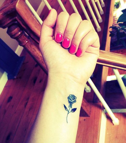 rose tattoo design on wrist