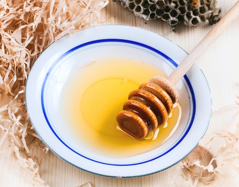 Plate of honey with honeycombs